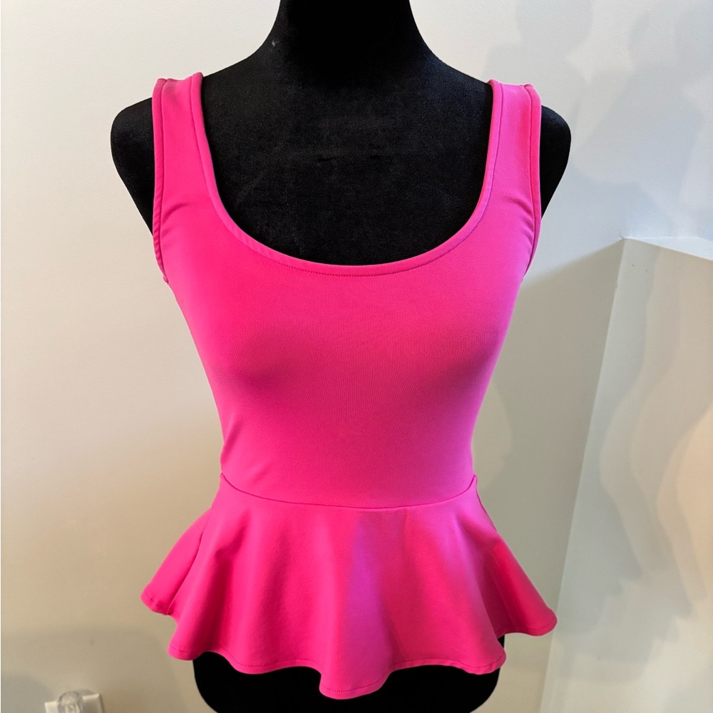 bebe Brand New Pink Peplum Top in XXS.
